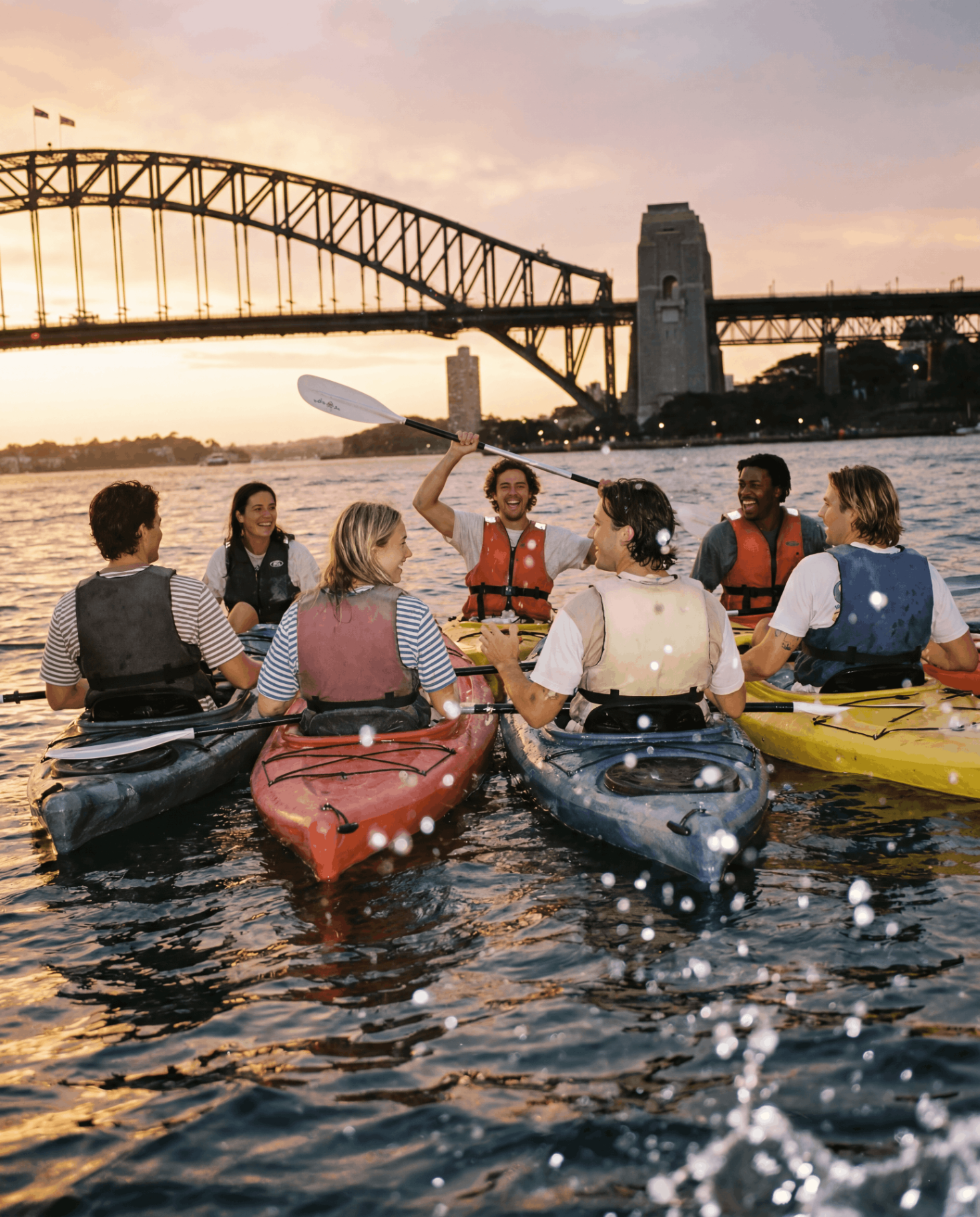 A group kayaking together on open water